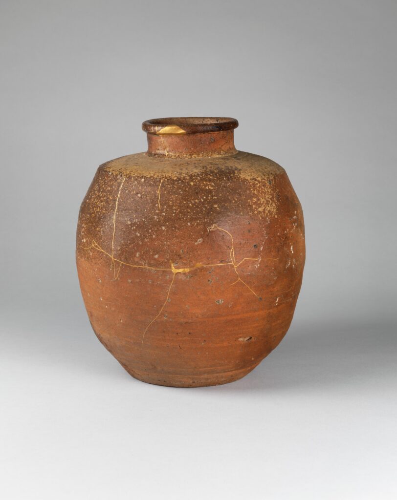 Seventeenth-century Shigaraki tea jar with visible gold-lacquer kintsugi repairs