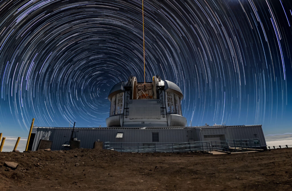 Long-exposure star trails circling Polaris above Gemini North Observatory