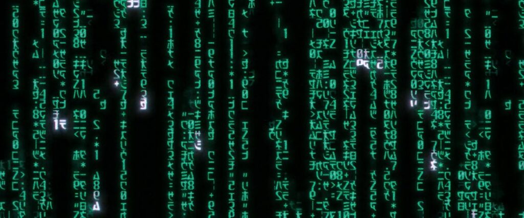 Green Matrix digital code imagery from The Matrix; editorial film still used for commentary.