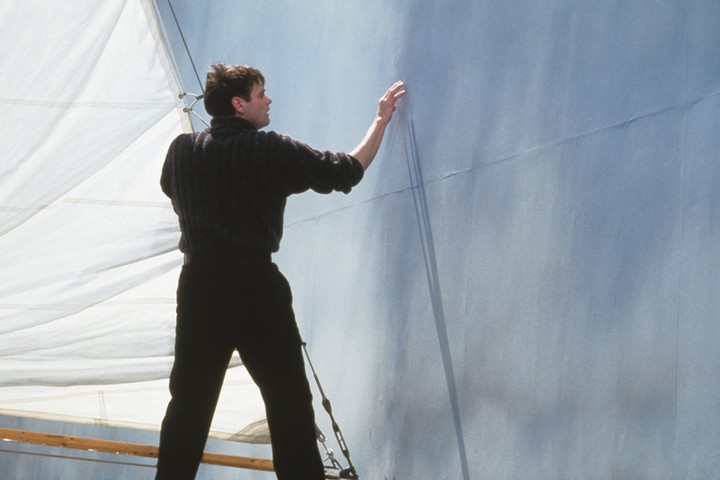 Jim Carrey as Truman Burbank touching the wall at the edge of his artificial world in The Truman Show (1998)