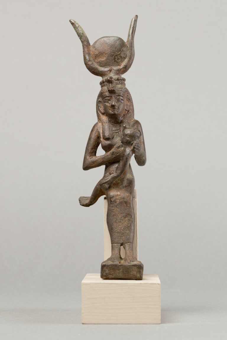 Isis holding and nursing her son Horus, ancient Egyptian bronze statuette